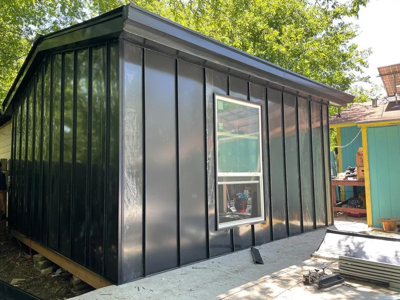 Black standing seam metal wall panels for Roof Inspection in Freeport